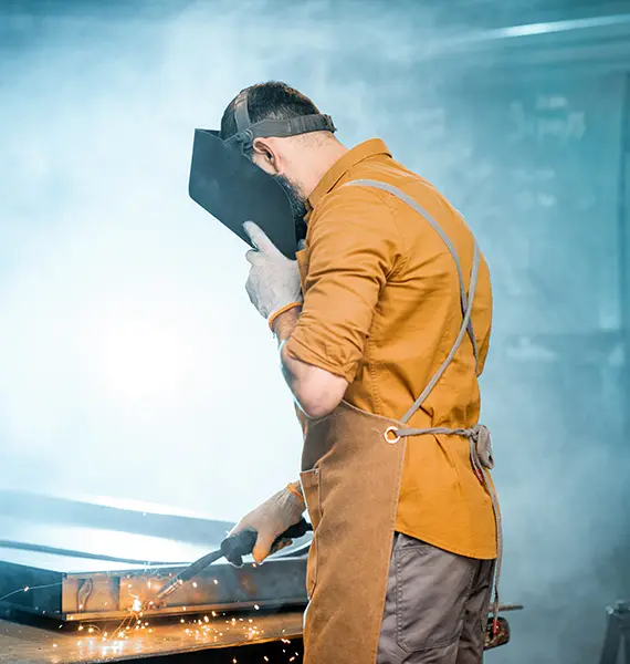 welder-working-with-metal-at-the-workshop