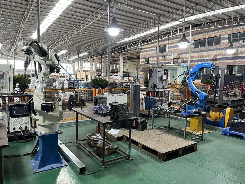 Dongji automated robotic welding station with industrial welding robot performing precision welds on sheet metal components 24/7