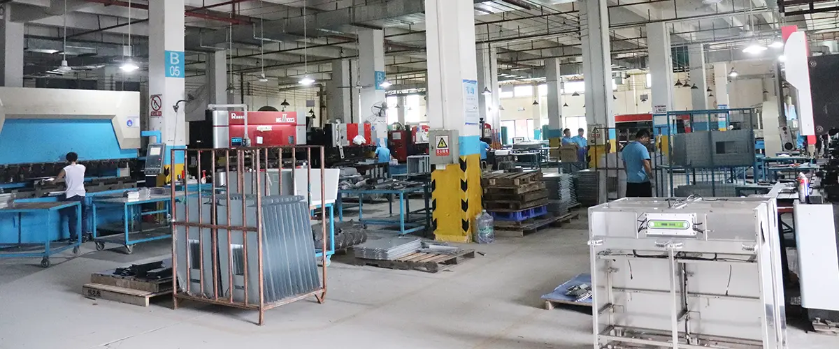 Dongji Intelligent Equipment 30,000㎡ sheet metal fabrication factory floor showing CNC machines and robotic welding stations in Jiangmen Guangdong